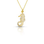 gold plated seahorse necklace with white enamel