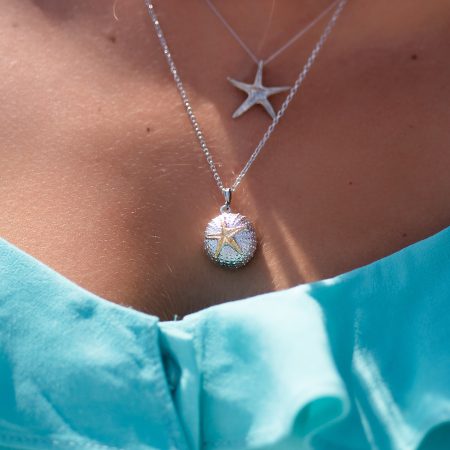 girl wearing sterling silver sea urchin necklace