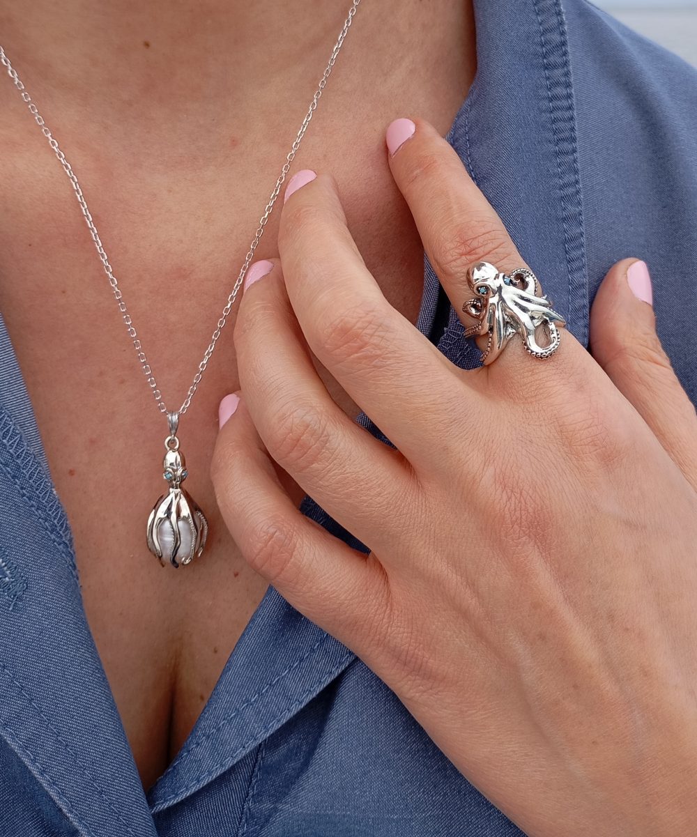 Woman wearing Sterling silver statement octopus ring and necklace